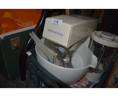 A vintage Kenwood mixer with whisk and K beater also blender attachment.