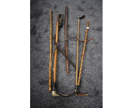 A selection of vintage riding crops including horn handled and two with silver or sliver plated collars.