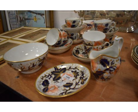 A 19th century part tea service in the Imari pallet comprising of cups and saucers, jug and sugar basin, some AF, historic re