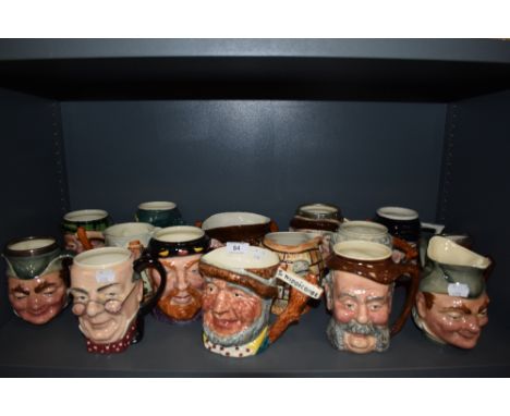 A selection of vintage novelty character and Toby style jugs.