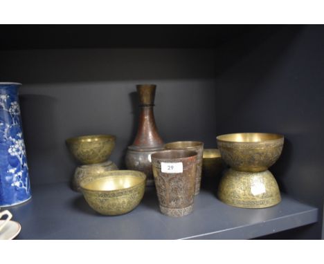 A selection of vintage brass ware having middle eastern designs, including vase and bowls.