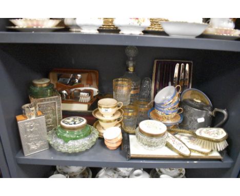 A mixed lot of items including dressing table set, glass ware, travel sets, cups and saucers and more.