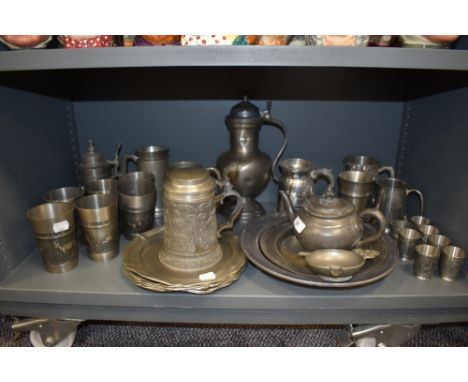 A varied lot of vintage and antique pewter ware including plates, beakers, tankards and more, including Georgian examples.