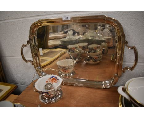 A large silver plated butlers tray of plain form with raised rim and long service presentation inscription to centre and a ce