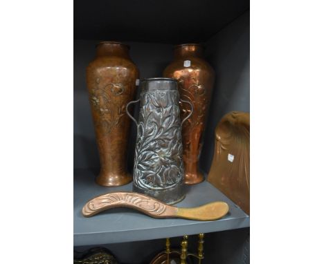 A pair of embossed copper vases in the Art Nouveau style,both marked to undersides, another handled vase and a crumb tray and