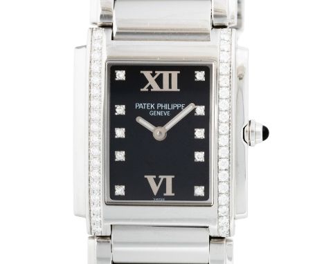 PATEK PHILIPPE Twenty-4 "Factory Diamonds" Damenuhr, Ref. 4910/10A-001. Full Set 2004. Edelstahl, Gehäuse mit 36 Brillanten, 
