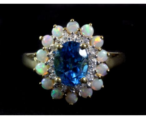 A 9ct yellow gold blue topaz, diamond and opal cluster ring, (R.5).