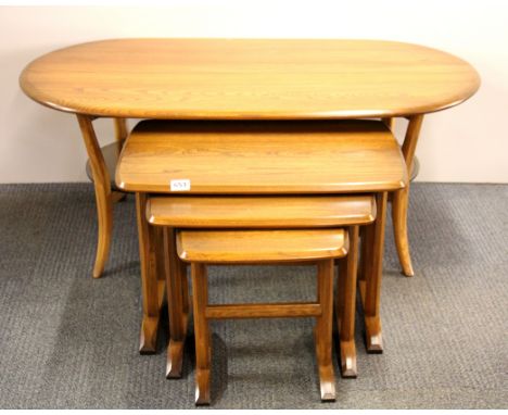 A Ercol style oak nest of three tables and an Ercol coffee table.