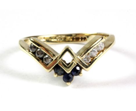 A 9ct yellow gold sapphire and white stone wishbone ring, (M.5).