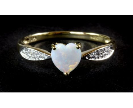 A 9ct yellow gold ring set with a heart shaped opal and diamond set shoulders, (O.5).