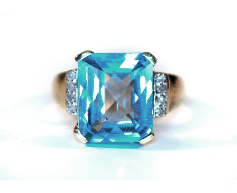 A 9ct yellow gold blue topaz and diamond set ring, (M.5).