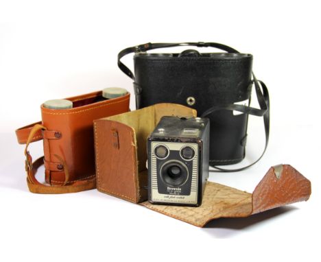 Two pairs of binoculars and a box camera.