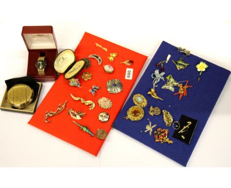 Two pads of costume jewellery brooches, a gents watch and a Stratton compact.