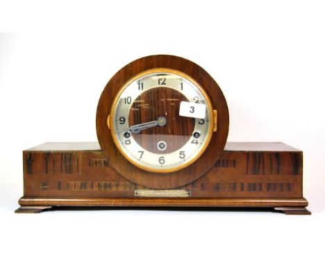 An Art Deco walnut veneered mantle clock, W. 44cm.