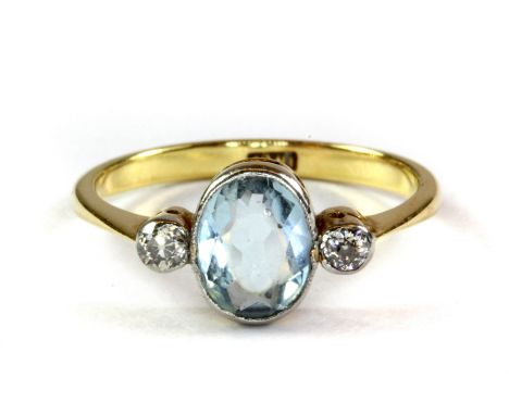 An 18ct yellow gold aquamarine and diamond set ring, (M.5).