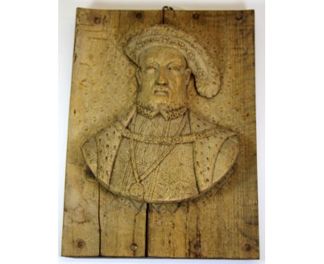 A rare 16th / 17th century carved oak panel portrait of King Henry VIII, 27 x 37cm