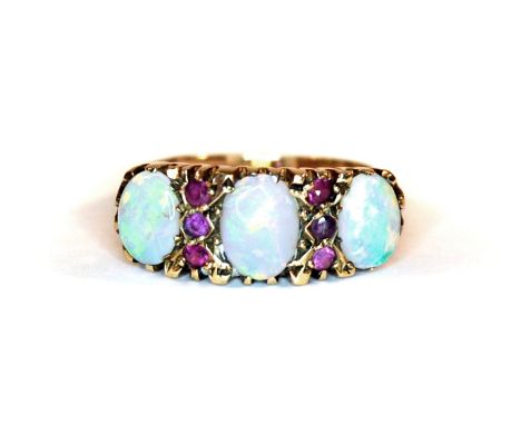 A 9ct yellow gold opal and ruby set ring, (M).