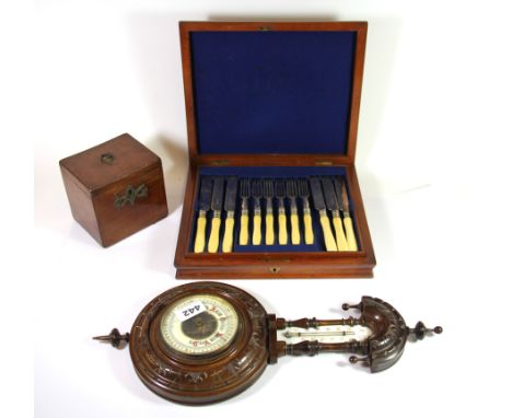 A vintage tea caddy, a barometer and a part cutlery set.