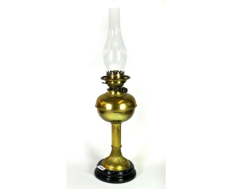 A brass oil lamp, H. 65cm.