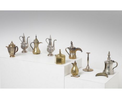 Islamic Art A group of nine metalwork  Central Asia and Iran, 19th-20th century . . Cm 14,00 x 23,50. Including 7 coffee pots