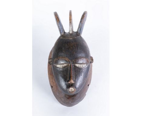 African art Portrait mask, BauleIvory Coast. . Cm 19,00 x 37,00. Dark patina wooden mask with traces of pre-existing polychro