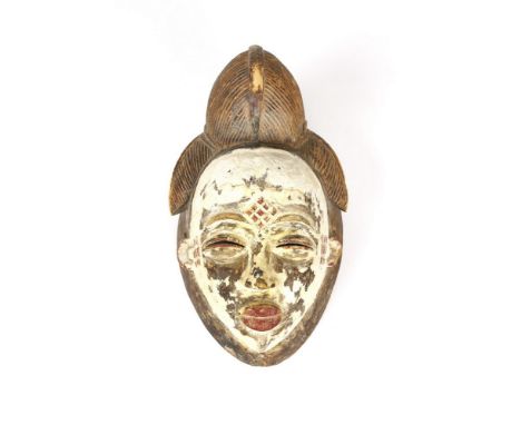 African art A Punu “white mask” okuyGabon  . . Cm 17,00 x 31,00. whitened with caolin (pemba) and carefully delineated high c