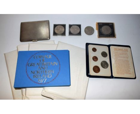 A silver engine turned cigarette case, Birmingham 1938; commemorative coins and proof sets