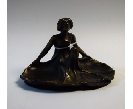 An Art Nouveau cast bronzed metal pin dish as a maiden, 12cm in width, 7.5cm in height