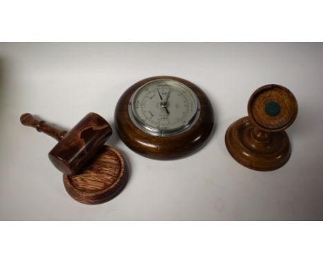 An aneroid barometer; a treen pocket watch stand, etc (4)