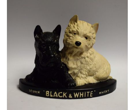 Advertising - a Black and White scotch whisky figural group