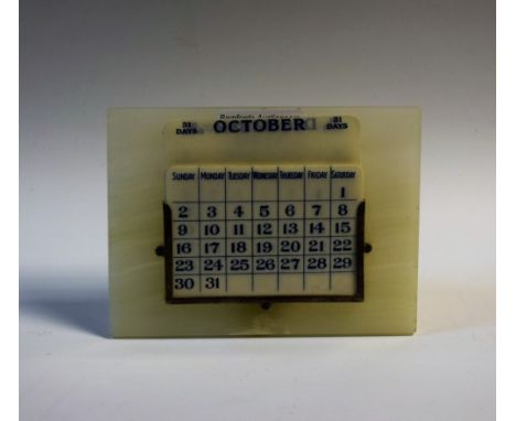 An Art Deco silver-mounted white onyx desk calendar, 13.5cm wide, marked Sterling, c. 1935