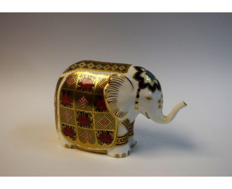 A Royal Crown Derby paperweight,  Elephant, raised trunk, gold stopper, 15cm wide, printed marks, boxed