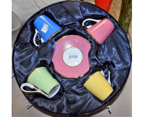 Ceramics - a Royal Worcester coffee set, harlequin colours, six coffee cans and saucers, in original circular box