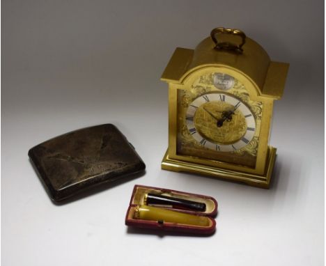 A silver cigarette case, Birmingham 1931, 132g; a cigarette holder with yellow metal collar, cased; another similar; a Swiza 