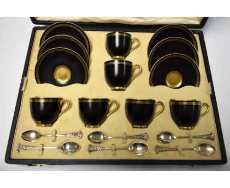 A set of six Royal Worcester demi tasse coffee cups and saucer with black background gilded with a greek key border in Art De