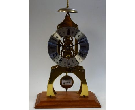 A 20th century novelty skeleton clock, 13.5cm silvered chapter ring inscribed with Roman numerals, the lacquered brass frame 