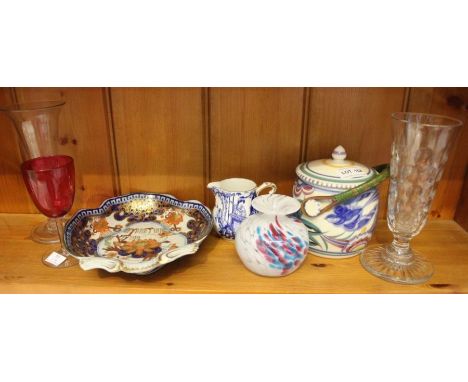 A shelf full of collectable china and glassware from the 19th and 20th century