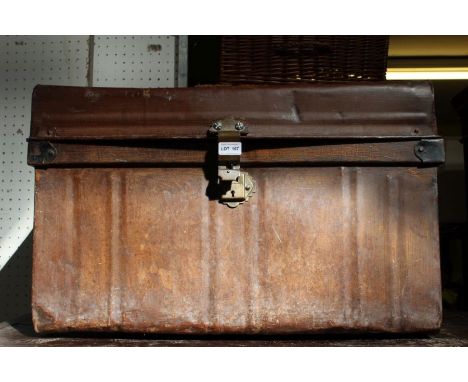 A tin travel trunk with side handles &amp; flat top