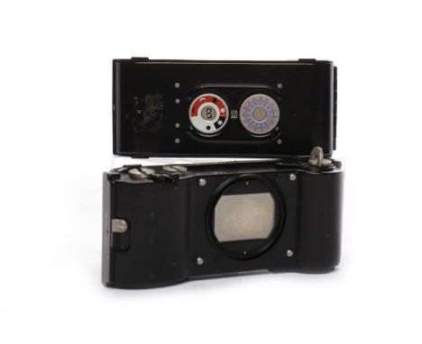 TWO ERNST LEITZ WETZLAR GERMANY D.B.P. 1074601 FILM HOLDERS black finish; along with a Leitz Filmaufspuler 'afloo' film winde