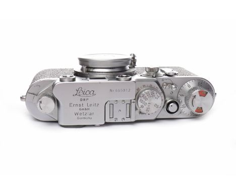 1953 LEICA IIIF CAMERA chrome finish, serial number 665912, self-timer, with collapsible Leitz Elmar f= 5cm 1:35 lens and len