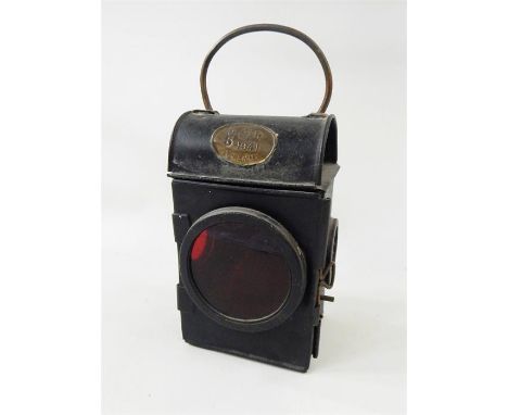 Railway hand lamp, SNLW Limited, plated GR 1941 with red lens and internal burner, 26cm high over the handle   