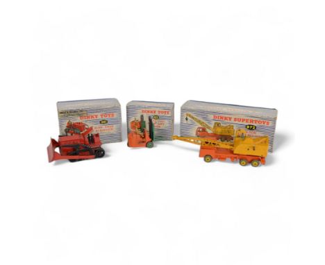 Three Meccano Dinky Toys diecast models, comprising Coventry Climax Fork Lift Truck no. 401, in orange and green, Blaw Knock 