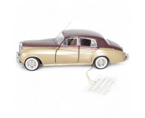 Franklin Mint 1:24 scale 1955 Bentley S diecast model no. B11XJ03, in gold and maroon with chrome trim and tan interior, in o