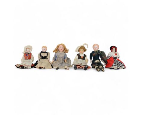 Six small 19th century and later continental bisque head dolls, including German made boy with painted features, moulded hair