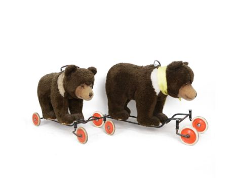 Two Steiff ride on bears, circa 1950s, each with brown mohair body and light brown muzzle, upon a metal frame with rubber and