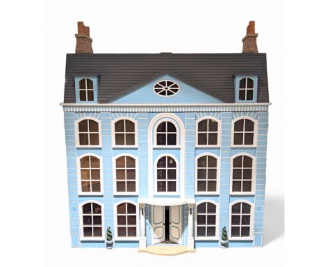 1:12 scale Georgian style wooden double fronted four-storey dolls house with pale blue stucco finish under a faux tiled roof,