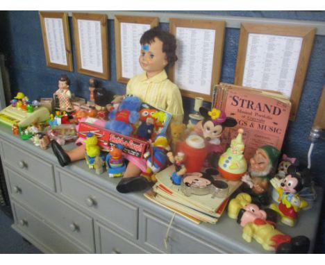 A large quantity of vintage children's toys to include a large doll, children's books to include Disney and Ladybird, magazin