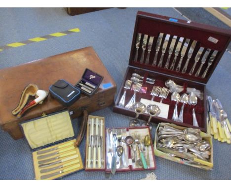 A canteen of John Stephenson stainless steel cutlery, six setting, together with a small vintage leather suitcase containing 