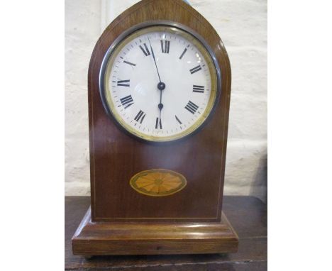 An early 20th century mahogany mantle clock with key 