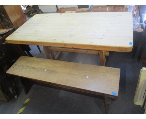 A pine plank constructed table and an oak bench 